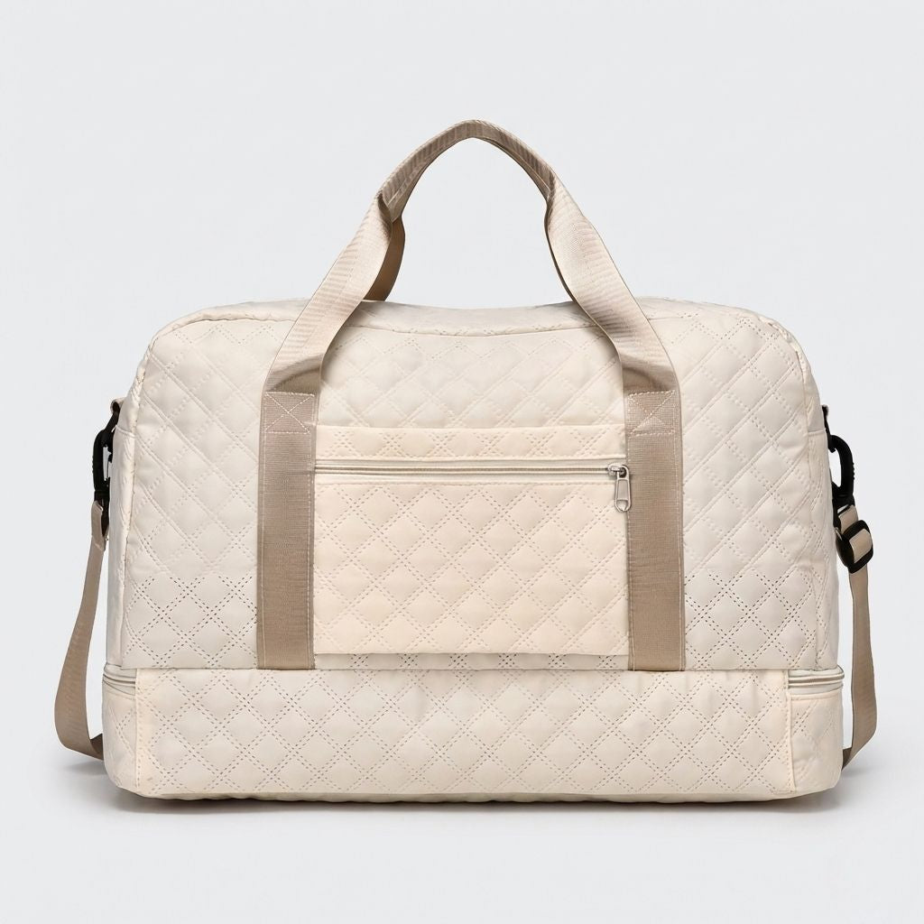 Dos du sac blanc crème, poche zippée centrale, passant trolley intégré et compartiment chaussures en bas