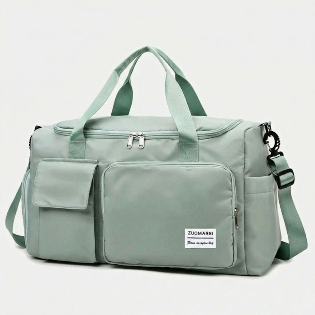 Sac de voyage femme vert menthe en nylon satiné, vue de face, deux poignées et poche frontale zippée imperméable