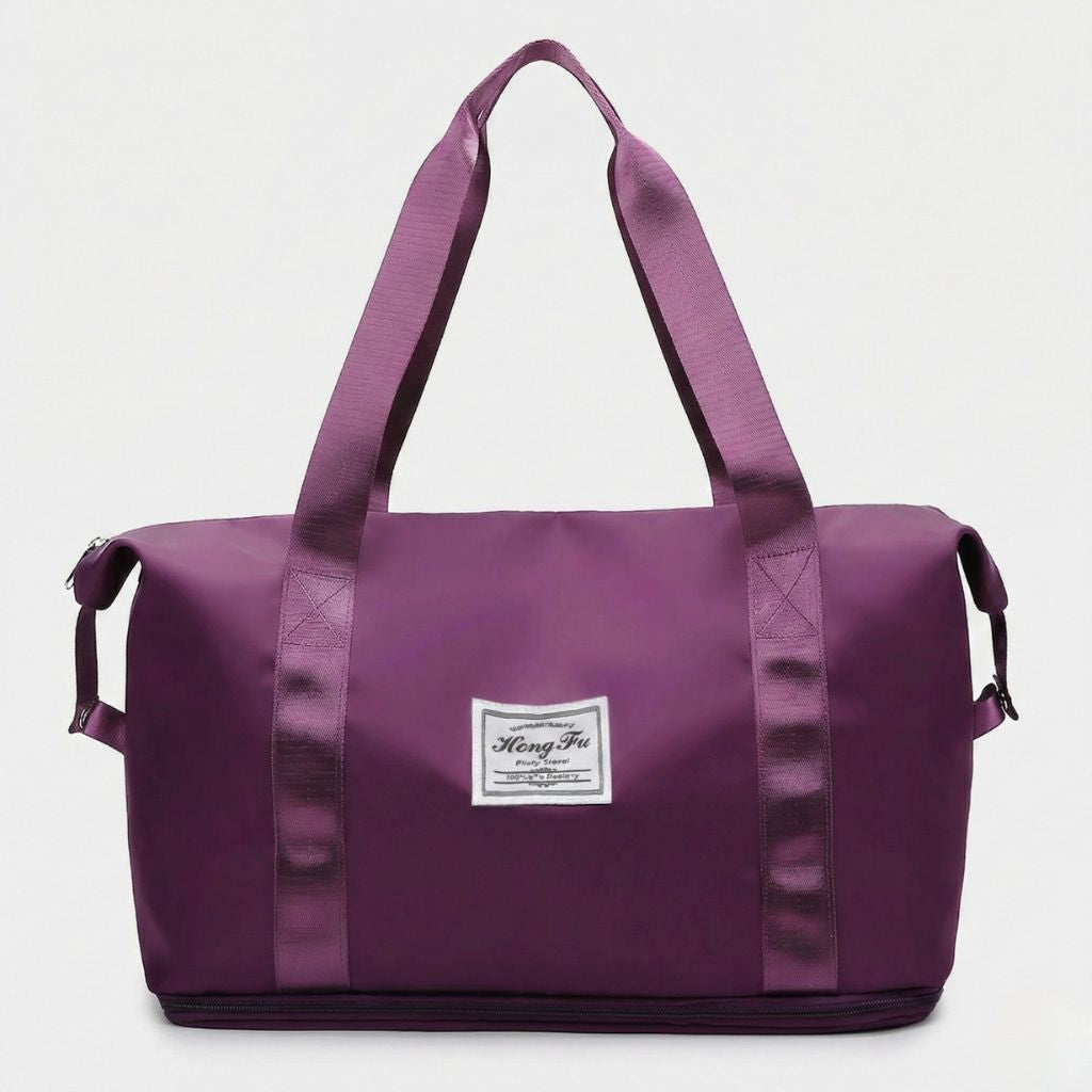 Sac de voyage femme lilas, vue de face, poignées satinées ton sur ton et étiquette tissée, format cabine extensible