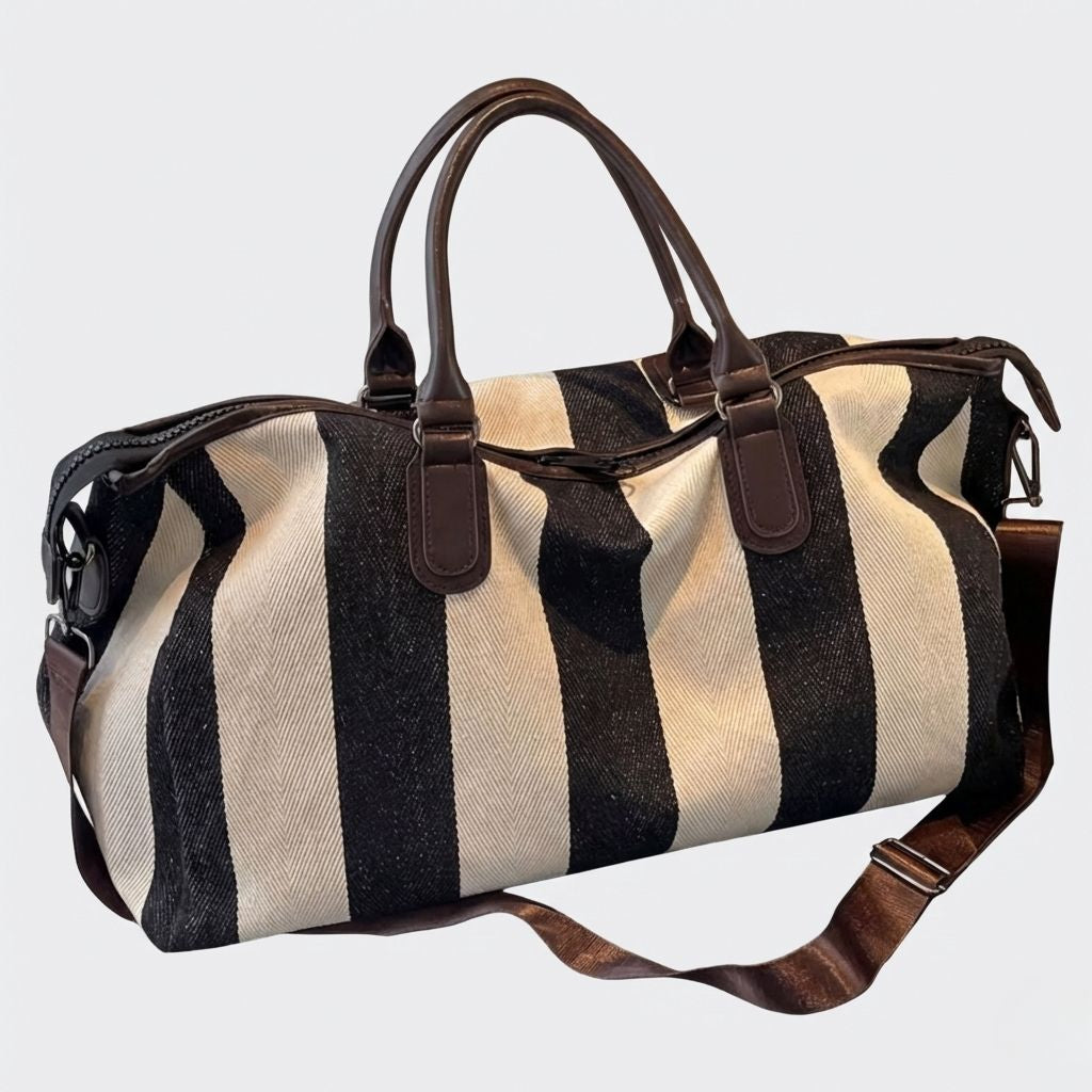 Sac de voyage femme en toile rayée noir et beige, poignées et bandoulière en simili cuir marron réglable