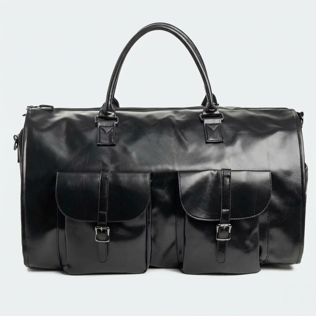 Face du sac cabine noir simili-cuir avec double poche à rabat à boucle métallique et poignées rondes