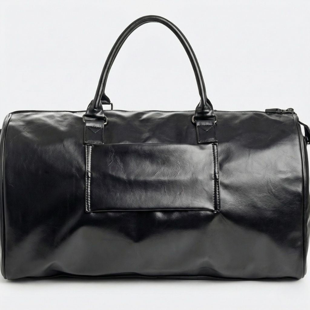 Dos du sac cabine noir simili-cuir avec grande poche plate à glissière et zip latéral, vue arrière