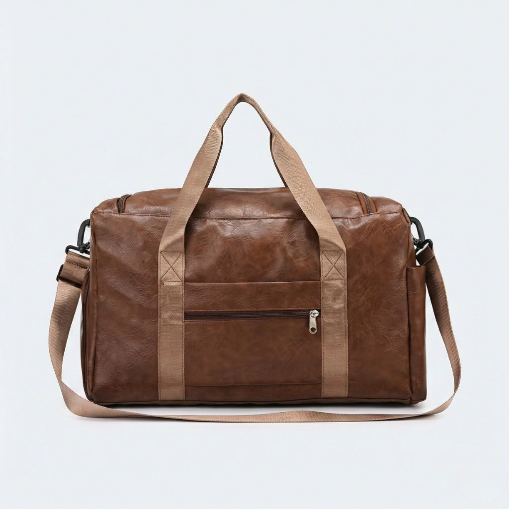 Dos du sac cabine marron vieilli avec poche zippée centrale et sangle textile beige transversale